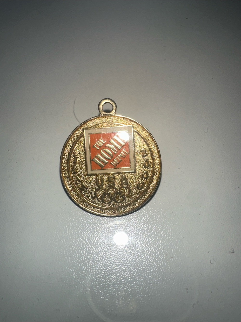 The Home Depot Gold Medallion Pendant with Orange Logo